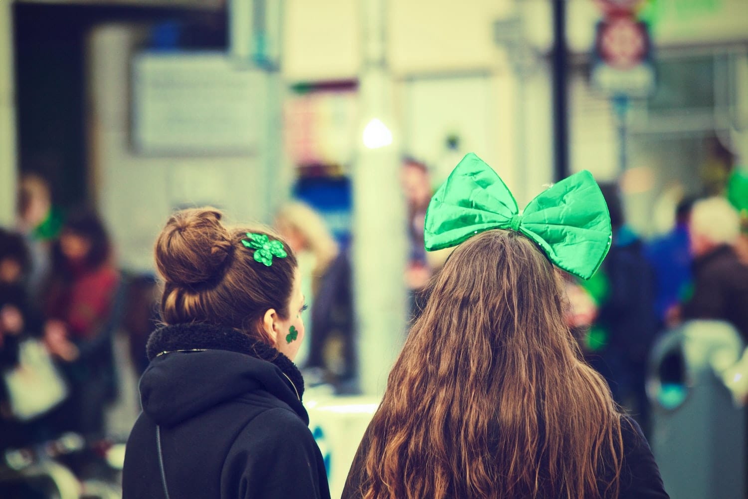 Girls wearing green bows in their hair for St Patrick's Day