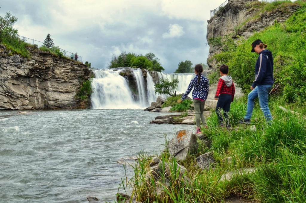 Kids and mom at the base of Lundbreck Falls near Crowsnest Pass