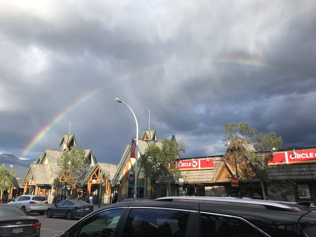 Downtown Jasper with a rainbow over it