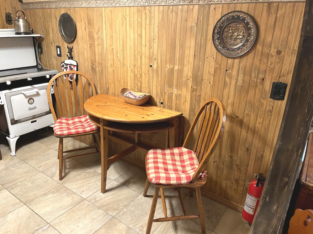 Kitchen table, chairs, and stove in The Burrow