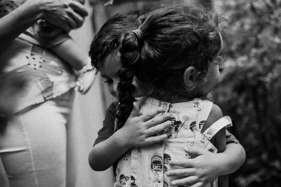 Black & white photo of Children hugging