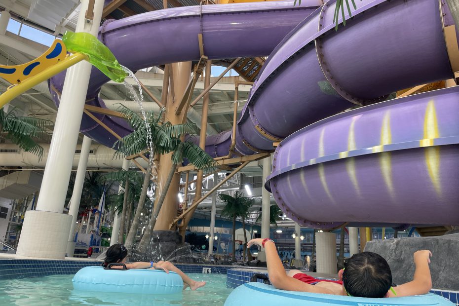 Boy and girl float down the lazy river in blue tubes in the Syncrude Aquatic Centre in Fort McMurray.